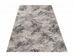 Moderner beiger Teppich mit zartem Muster