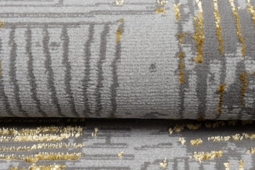 Moderner grauer Teppich mit Goldmotiv - Die Größe des Teppichs: Breite: 140 cm | Länge: 200 cm