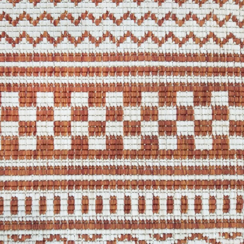 Obojstranný vzorovaný koberec oranžovej farby