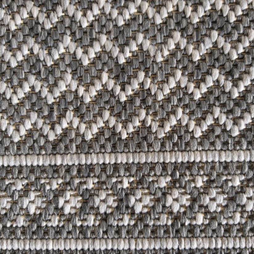 Universell einsetzbarer grauer Teppich mit zartem Muster