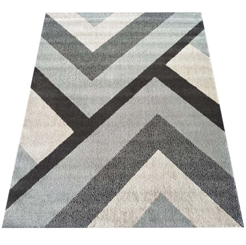 Moderný koberec s geometrickými vzormi v sivých farbách