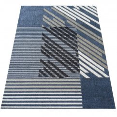 Tappeto di design in blu con strisce