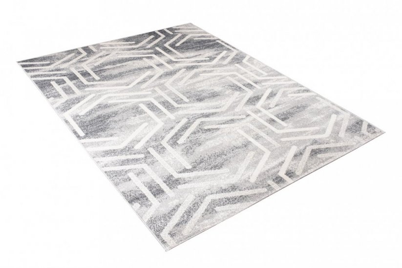 Světlý designový koberec s geometrickým vzorem
