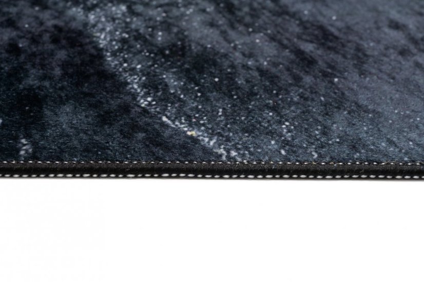 Tappeto di design nero con motivo astratto