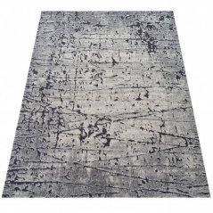 Moderní abstraktní šedý koberec