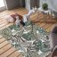 Beigegrüner Teppich mit Blattmotiv