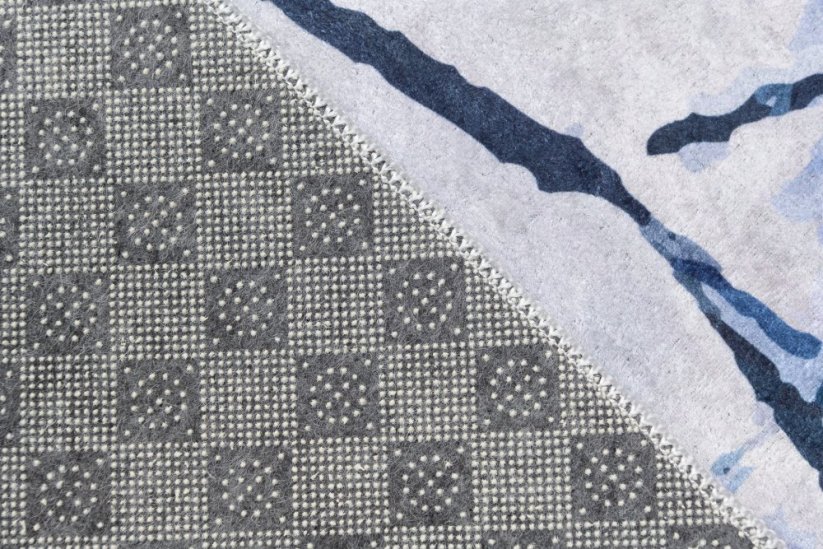 Jednostavan bijelo-plavi tepih s apstraktnim uzorkom