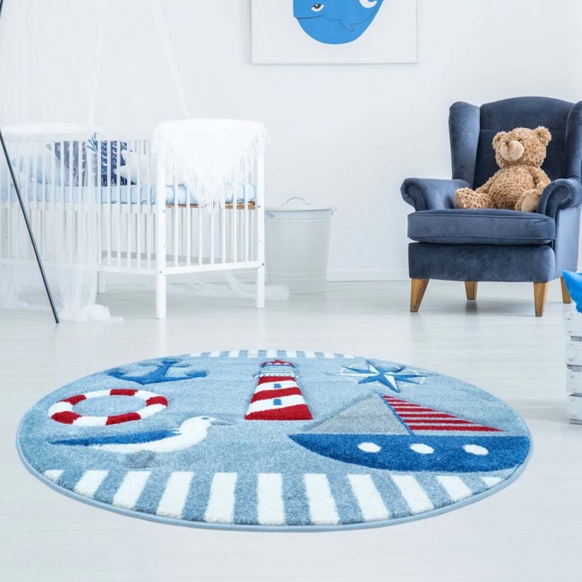 Okrúhly koberec s námorníckym motívom modrej farby