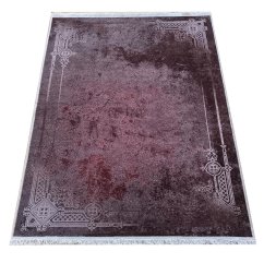 Tappeto scuro con cornice e patina orientale pregiata