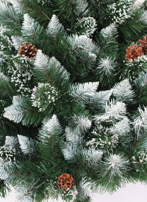 Luxus, enyhén hópelyhesített mesterséges karácsonyi fenyőfa kúpokkal 180 cm-es törzsön