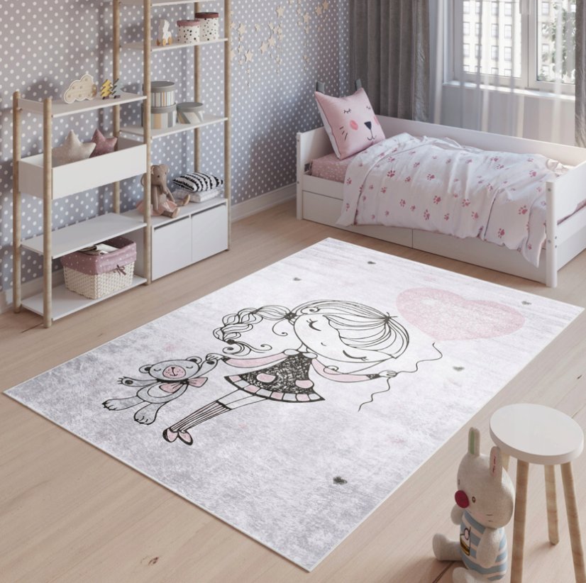 Rosa Kinderteppich mit einem Mädchen mit Luftballon