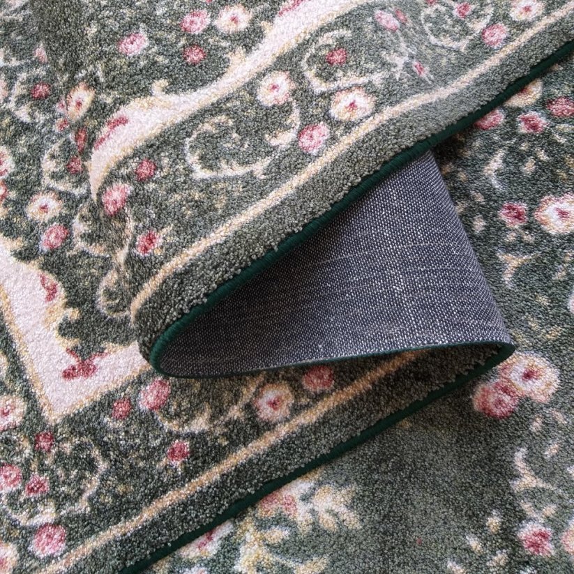 Zeitloser grüner rustikaler Teppich mit rosa Blumen