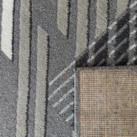 Tappeto di design in grigio con strisce