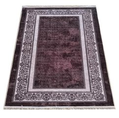 Elegante tappeto marrone con bordo ornamentale