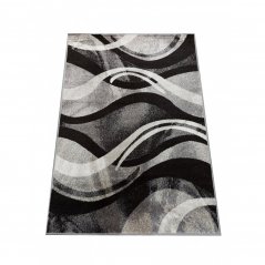 Origineller Teppich mit abstraktem Muster in grauer Farbe