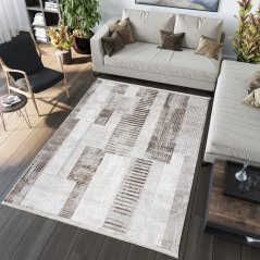Tappeto vintage di design con motivi geometrici nei toni del marrone