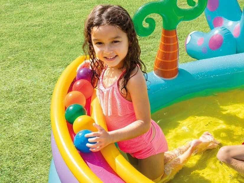 Piscina a forma di parco giochi con dinosauro