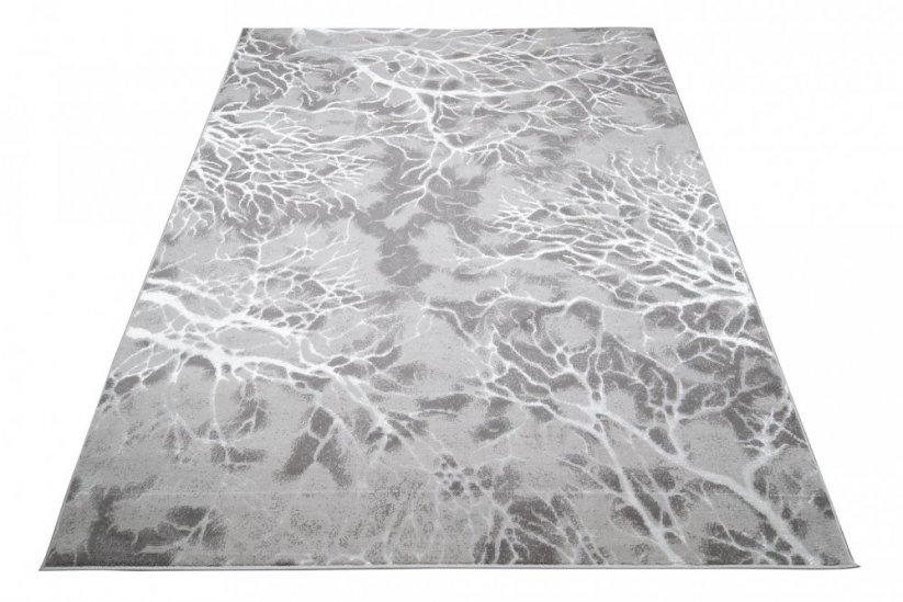 Jednoduchý moderný koberec sivej farby s bielym motívom