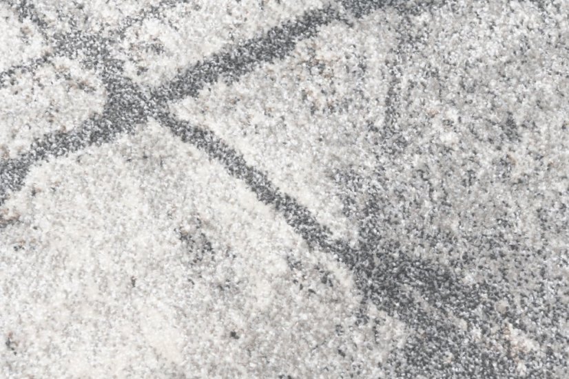 Beige-grauer Designteppich mit abstraktem Muster 
