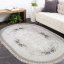 Béžový oválny koberec s kvetinovým motívom do obývačky