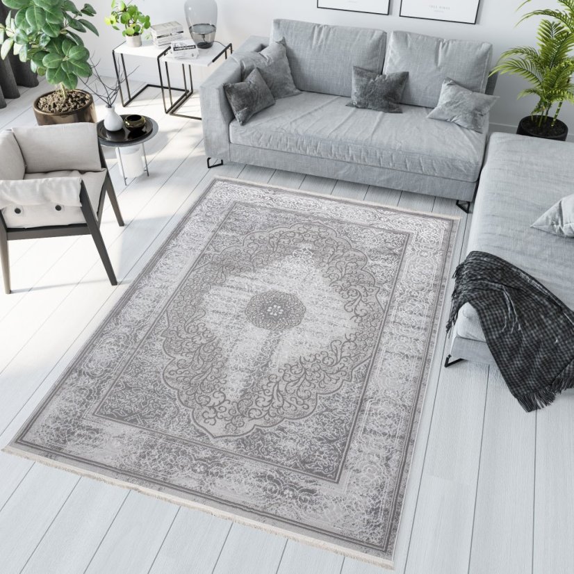 Esclusivo tappeto grigio con motivo orientale bianco