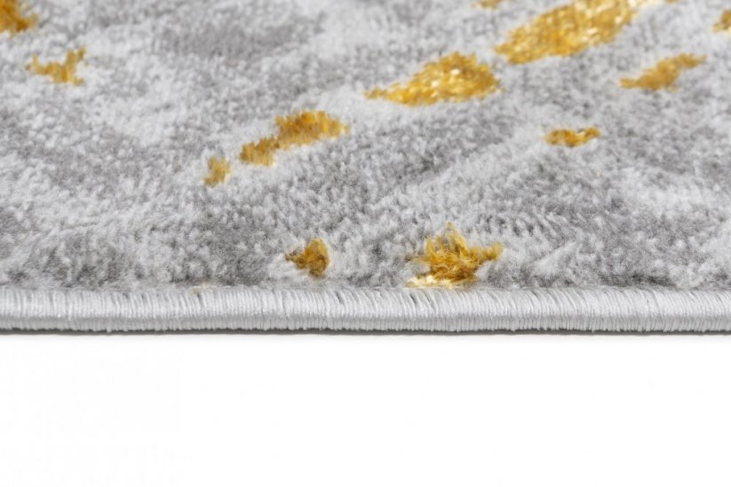 Moderan sivo-zlatni tepih za interijer