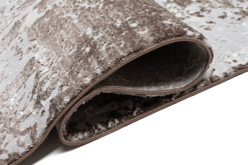 Beige-grauer Teppich im Vintage-Design