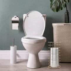 Zlatý kovový stojan na toaletný papier s lesklým povrchom