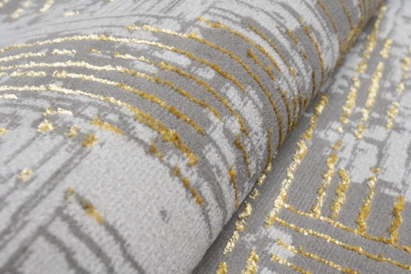 Moderní šedý koberec se zlatým motivem