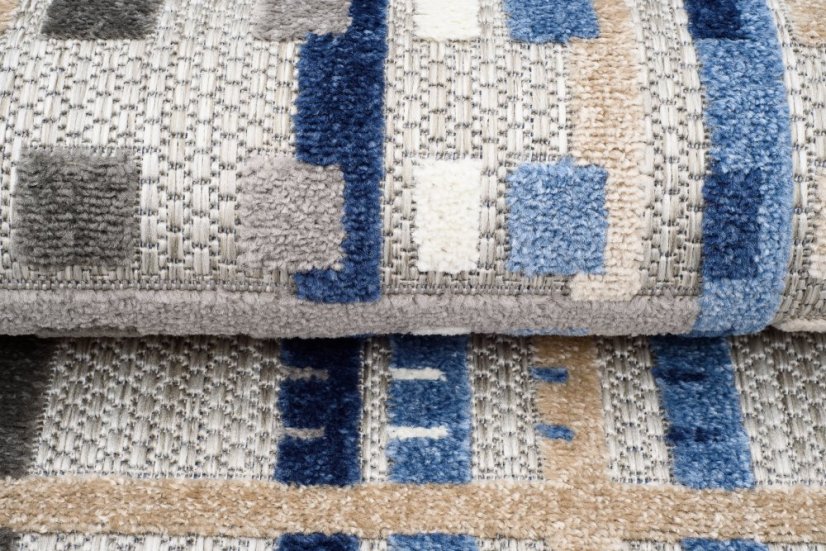 Grauer Terrassenteppich mit blauem Muster