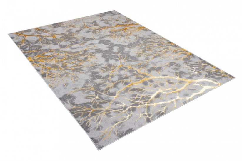 Jednoduchý moderný koberec sivej farby so zlatým motívom