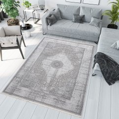 Esclusivo tappeto grigio con motivo orientale bianco