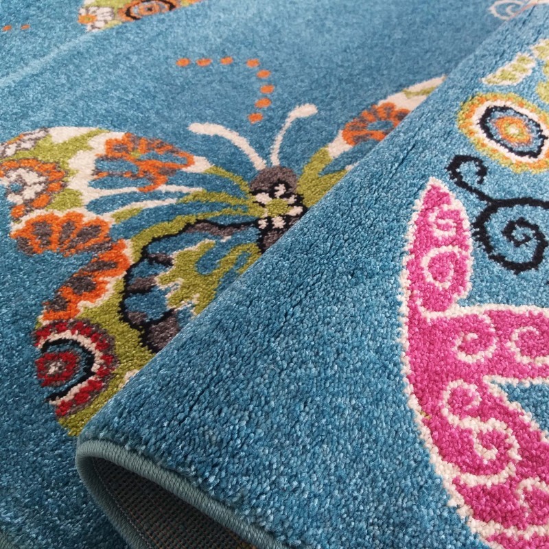 Teppich für Kinderzimmer in Blau mit Schmetterlingsmotiv