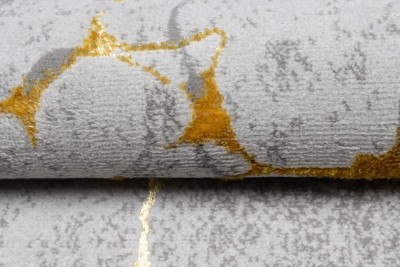 Teppich mit Goldmotiv für das Wohnzimmer