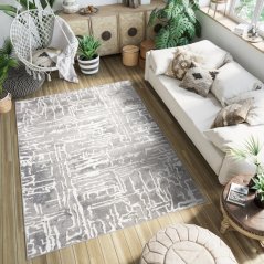 Sivi dizajnerski tepih sa svijetlim apstraktnim uzorkom