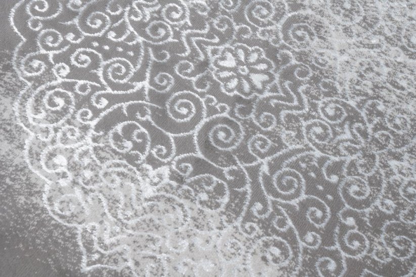 Moderner Teppich in grauer Farbe mit orientalischem Muster in weißer Farbe