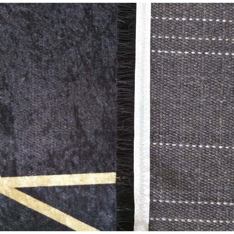 Moderan tepih u crnoj boji sa zlatnim motivom