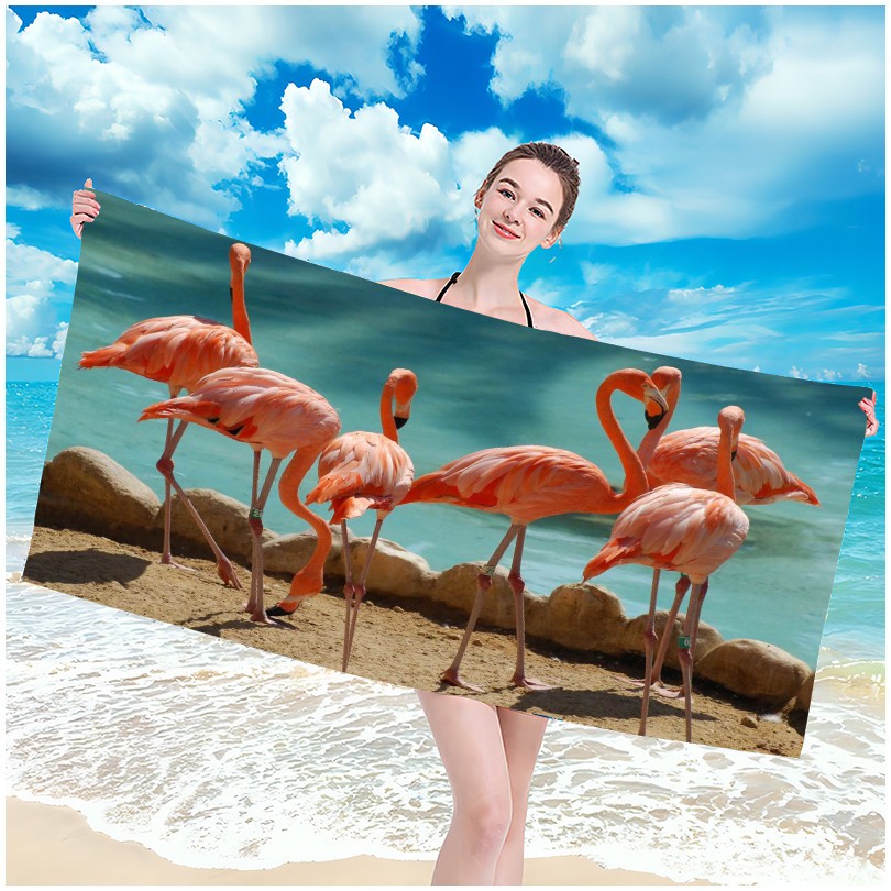 Strandtörölköző flamingó a parton motívummal 100 x 180 cm