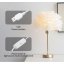 O lampă de masă elegantă cu LED și abajur din pene