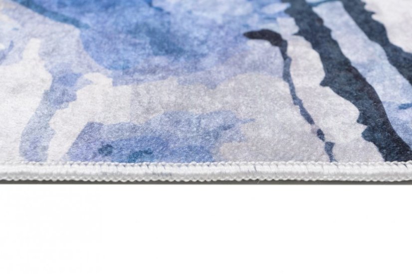 Semplice tappeto bianco e blu con motivo astratto