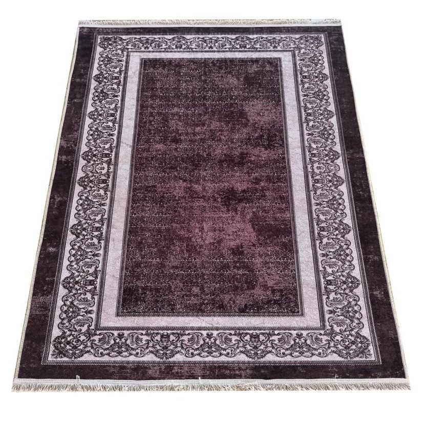 Elegante tappeto marrone con bordo ornamentale