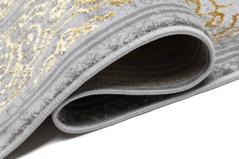 Ekskluzivni moderni sivi tepih sa zlatnim orijentalnim uzorkom