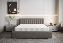 Šedá čalúnená posteľ s vertikálnym prešívaním na čele 180 x 200 cm