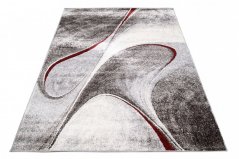 Moderan tepih u smeđim nijansama s apstraktnim uzorkom