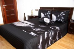 Čierne prehozy na posteľ s bielou odkvitnutou púpavou