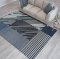 Дизайнерски килим в синьо с райета