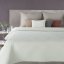 Velvet bedspread quilted in geometric pattern