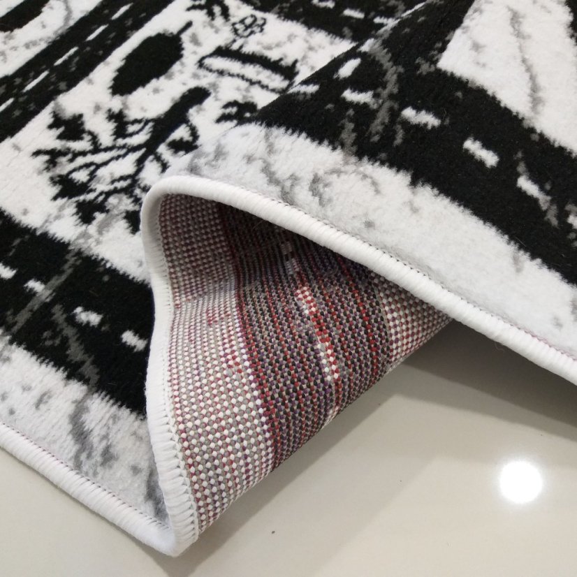 Čierno biely detský koberec s motívom mesta