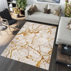 Nadčasový koberec do obývacího pokoje se zlatým motivem
