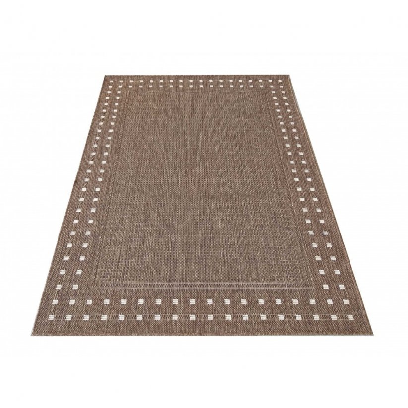 Béžový koberec s jednoduchým geometrickým vzorem
